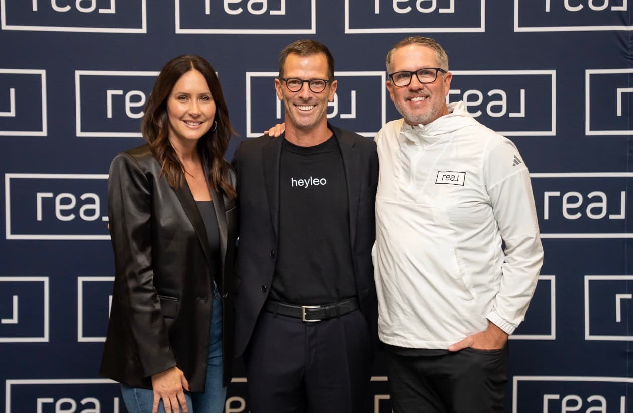 Joe, Amy, and team at a Real Brokerage event